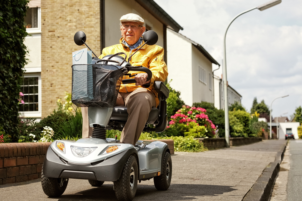 An,Elderly,Person,Drives,An,Electric,Vehicle
